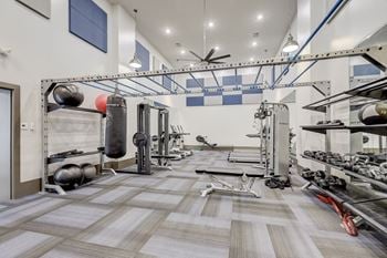 Two-story fitness and training center for yoga, cardio, and strength training